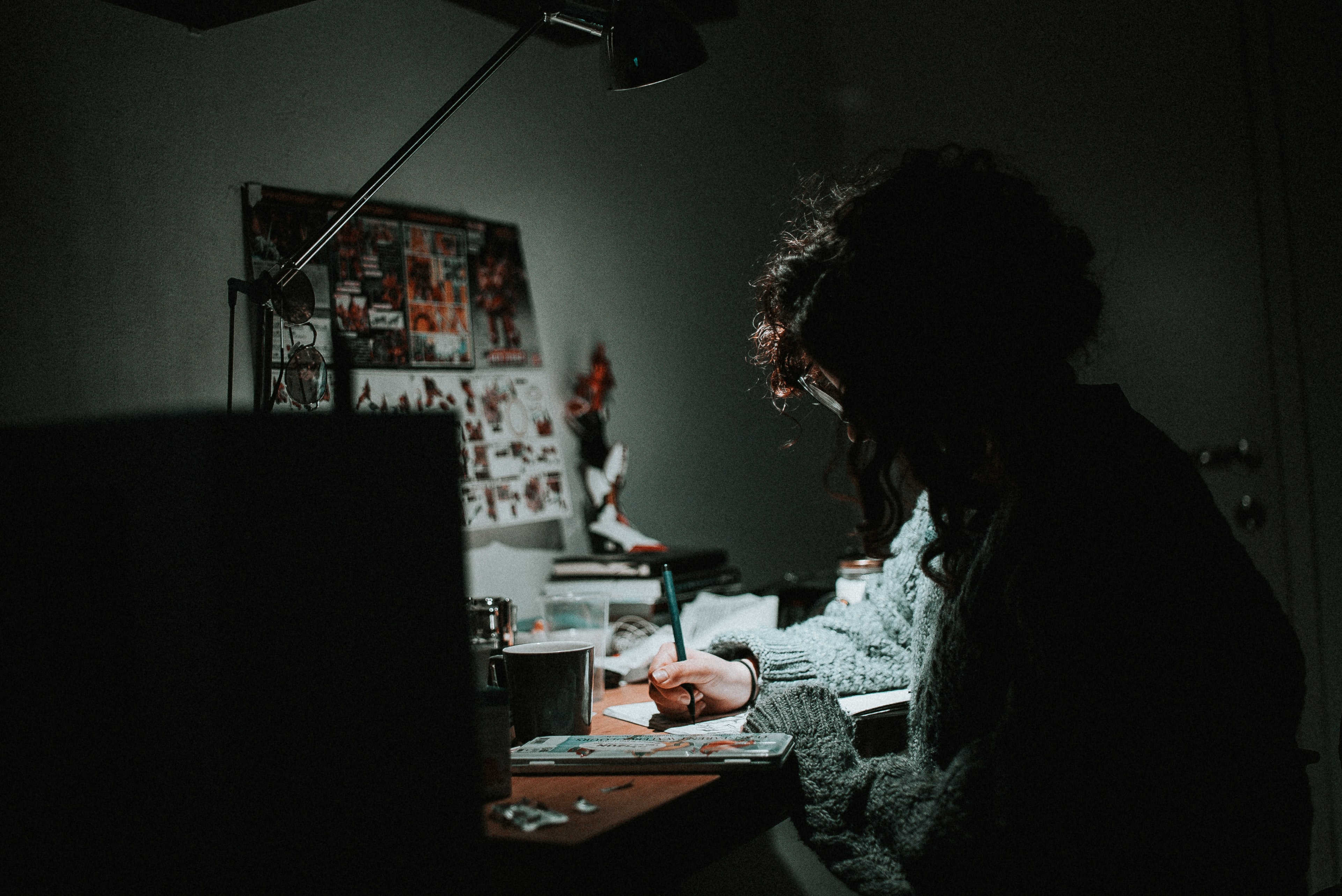 worker drawing on a piece of paper