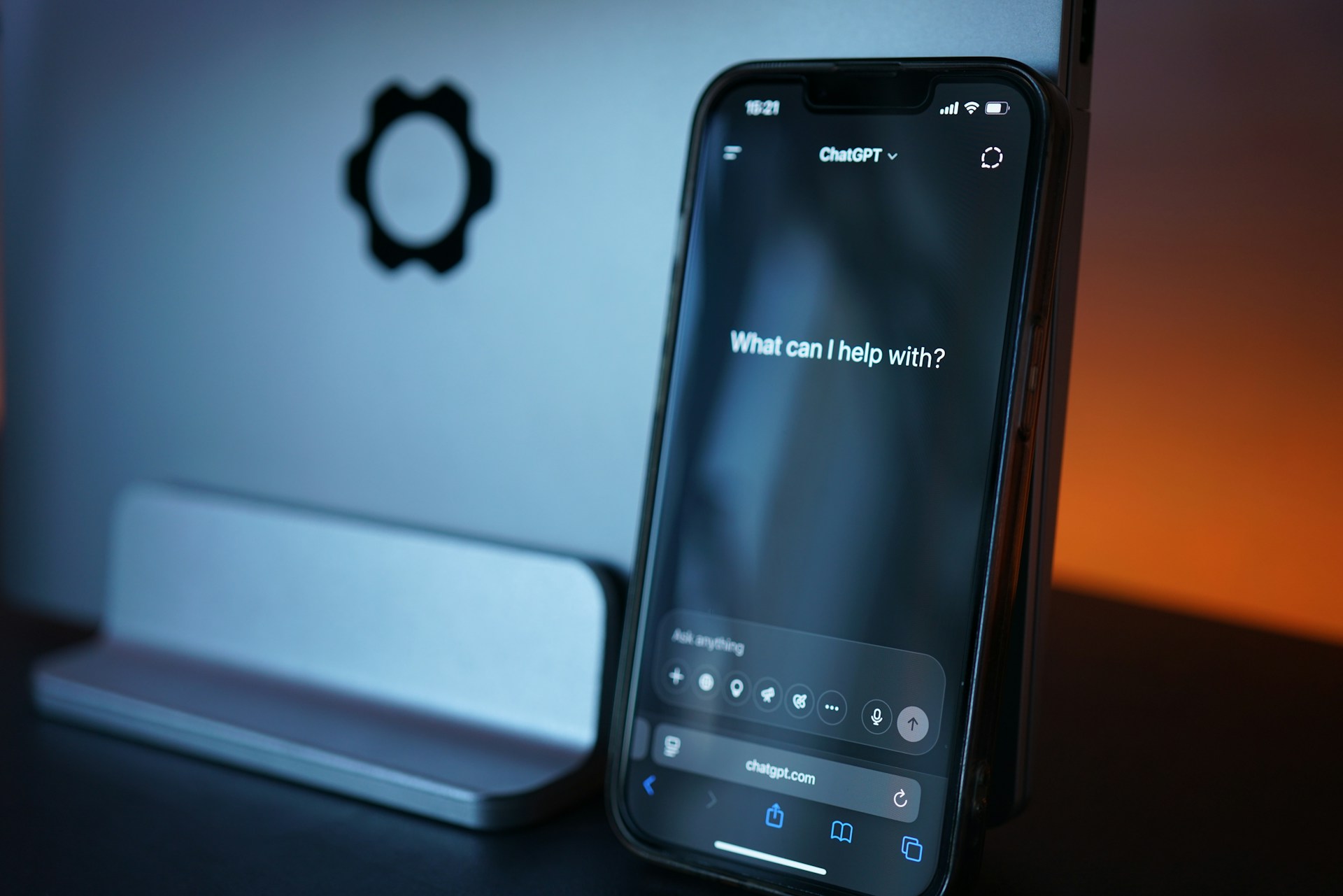 A smartphone screen is open to ChatGPT in browser